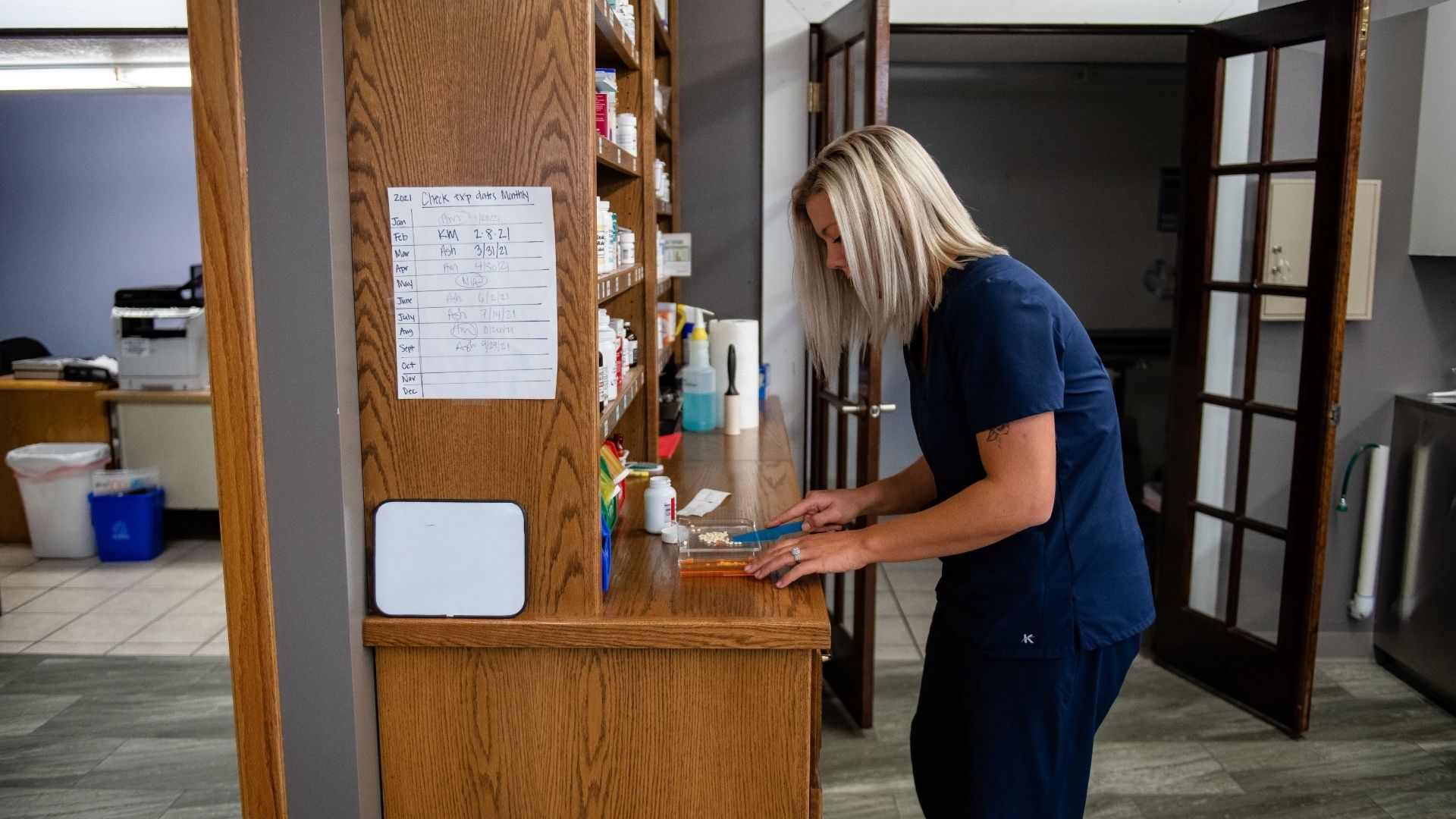 Eyota Veterinary Clinic – Team member at pet medicine cabinet
